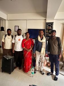 a group of people posing for a picture in a room at Sungava homestay in Mirik +13 photos
