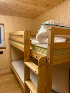 two bunk beds in a tiny house at Silumetras in Ventspils