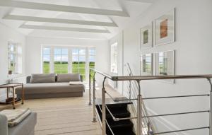 a living room with a couch and a table at Nice Home In Idestrup With Wifi in Idestrup