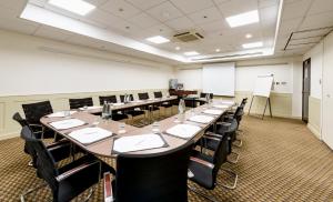 a large conference room with a long table and chairs at Holiday Inn York City Centre by IHG in York