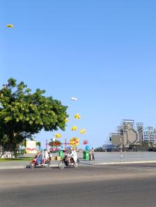 a group of people riding motorcycles on a city street at QN Home in Quy Nhon