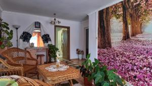 a room with a carpet of purple flowers at Casa Grigor in Călineşti
