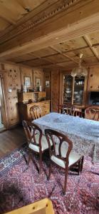 a dining room with a table and chairs at Casa Silvia in Promontogno
