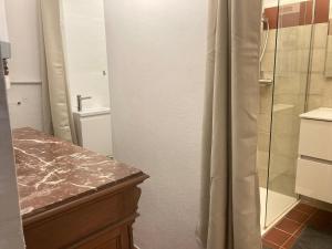 a bathroom with a shower and a sink and a toilet at Quiet, fresh, and nice in Letia