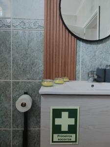 a bathroom with a sink and a mirror at Casa da Susy do Alvão in Vila Real +27 photos