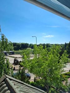 a view from the roof of a parking lot at Svečių namai miestelio centre in Mosėdis +1 photo