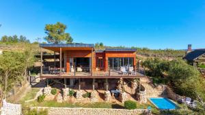 a house on top of a hill with a pool at Mountain Bungalow private hot tub&swimming pool in Wolseley