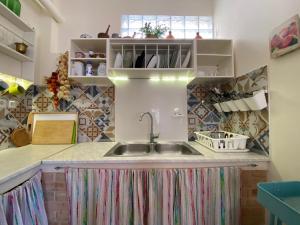 a kitchen with a sink and a counter at Island Traditional House in Poros