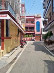 an empty street in a city with buildings at Veer Guest House in Bareilly