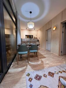 a dining room with a table and two chairs at Marjan bay in Tossor