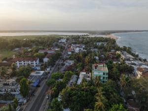 an aerial view of a town next to the ocean at Golden Breeze Arugambay in Arugam Bay