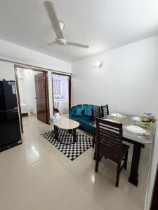 a living room with a couch and a table at Havene 11 in Dhaka
