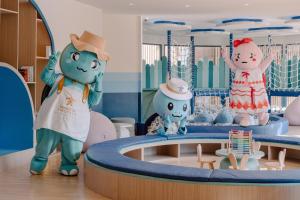a room with a group of hello kitty mascots at Khaolak Emerald Beach Resort and Spa in Khao Lak