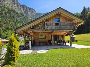 a log cabin in the mountains with a deck at Chalet le Nid independant mountain chalet in Morzine