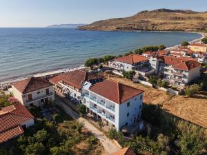an aerial view of a house on the shore of the ocean at Ser Rooms 05 in Petra