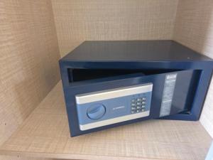 a blue microwave oven sitting on top of a counter at Coco's Corfu Apartments in Ipsos