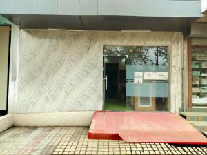 a store front with a red mat in front of a door at vista home stay in Lucknow +9 photos
