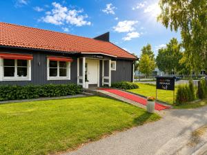 a building with a sign in front of it at Rum För Resande in Skellefteå