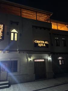 a building with a sign that reads central asia at Central Asia in Bukhara