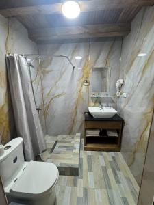 a bathroom with a toilet and a sink at Central Asia in Bukhara