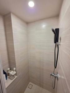 a bathroom with a shower stall with a shower at Phyll Condo Room in Wichit in Ban Rangeng +11 photos