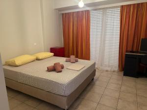 a bedroom with a bed with two towels on it at The salty studio in Rethymno