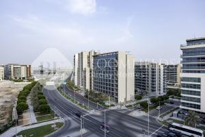 an aerial view of a city with tall buildings at Bloomfields 2BR in Lamar Raha Beach in Abu Dhabi