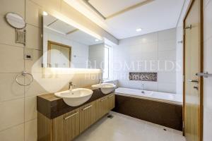 a bathroom with two sinks and a bath tub at Bloomfields 2BR in Lamar Raha Beach in Abu Dhabi +12 photos