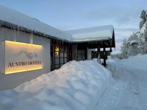 a pile of snow in front of a ski hotel at Austbø Hotell in Rauland