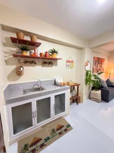 a kitchen with a sink in a living room at Thousand Journey 2 in Naga