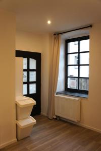 a bathroom with a toilet and a window at Hébergement atypique in Esch-sur-Sûre