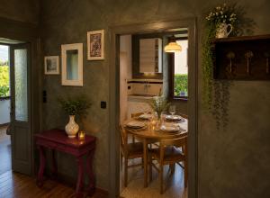 a dining room with a table and a window at Ortensia Apartment for 4 near Lake Como and Lugano in Lanzo dʼIntelvi