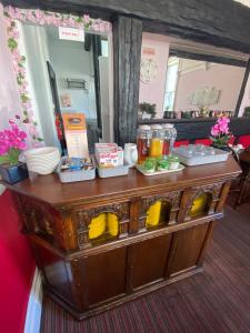 a wooden table with food on top of it at Windermere Bed and Breakfast in Windermere +14 photos