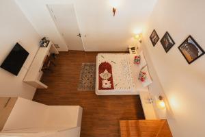 an overhead view of a living room with a table at Tethys Himalaya Resort in Solan