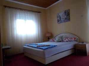 Postel nebo postele na pokoji v ubytování Guesthouse Feel Lake