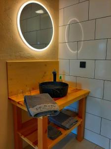a bathroom with a sink and a mirror at Estefana in Chambilly +13 photos