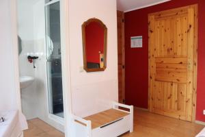 a bathroom with a sink and a mirror at Usedomer Blick in Ueckermünde +13 photos