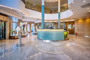 a lobby of a hotel with a reception desk at ELIA MARe Hotel ALL Inclusive - Free Beach Access in Kiten +172 photos