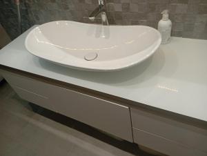 a white sink on a counter in a bathroom at Apartman DALIAROSE Sarajevo in Sarajevo +19 photos