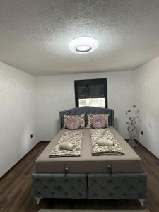 a bedroom with a large bed in a room at EMRAH RIVER UNA in Bihać +45 photos