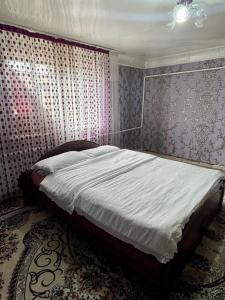 a bedroom with a bed in a room at Ali guest house in Sary-Mogul +12 photos