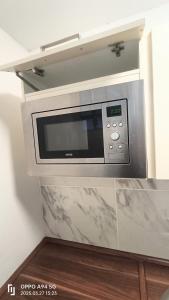 a microwave oven sitting on top of a counter at Neu-Isenburg in Neu Isenburg