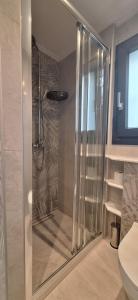 a shower with a glass door in a bathroom at VILLA MIPA Samos in Kámpos +20 photos
