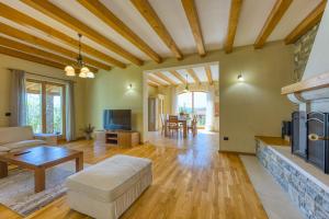 a living room with a couch and a fireplace at Villa Dol in Buzet
