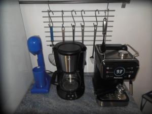 a coffee maker and a blender on a counter at Nagos Home in Nagós
