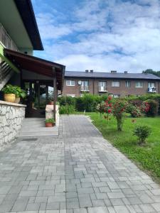 a building with a walkway in front of a building at Apartment SOFI Novi Travnik in Novi Travnik