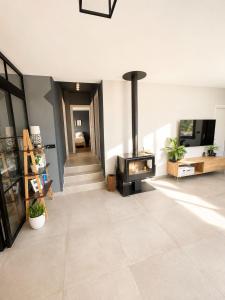 a living room with a wood stove in it at Villa ATLAS relax in Prinos