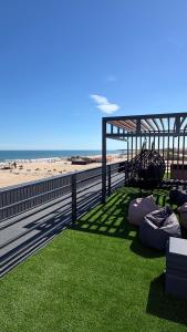 a view of a beach with a tent and grass at LESS HOTEL Затока in Zatoka