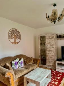 a living room with a couch and a table at Domček u Ferka in Dedinky
