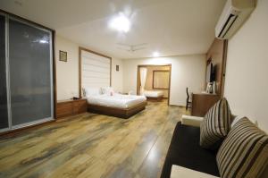 Postel nebo postele na pokoji v ubytování Vishal Lords Inn Gir Forest